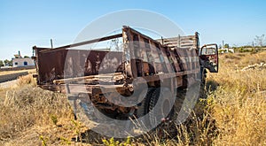 Old rusty truck abandoned on the grass