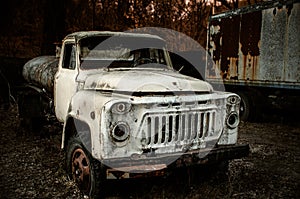 Old rusty truck abandoned at the in the woods