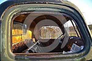 Old rusty truck with broken windows