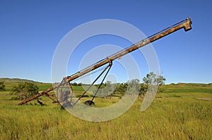 Old rusty tube grain elevator