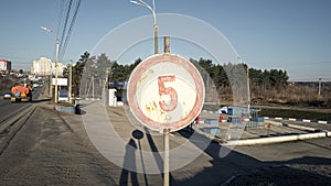 An old rusty vintage 5 km h speed limit road sign