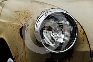 Old rusty Volkswagen Squareback headlight