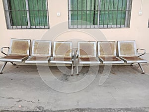 the old rusty waiting chairs in front of the room