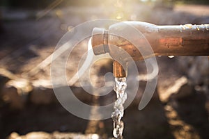 Old rusty water tap in garden