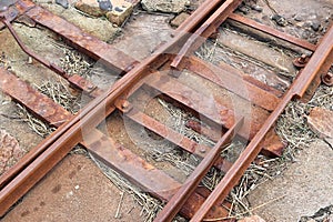 Old rusty weathered railroads right at the baltic sea coast