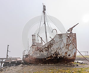 Old, rusty whaling ships and processing facilities at a now abandoned whaling station in Grytviken -on South Georgia island