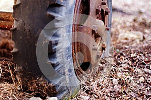 Old rusty wheel of abandoned machinery