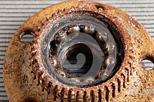 Old rusty wheel hub with a broken bearing. Bearing jamming. Automotive Part, close-up