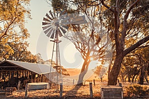 Old rusty windmill on a farm in McLaren Valley at sunset