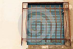 Old rusty window grates on the street in El Cabanyal, Valencia city.