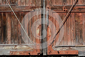 Old Rusty Wood Gate Texture Background. Red colored wooden background.