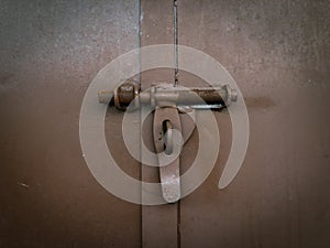 Old and rusty wooden door lock