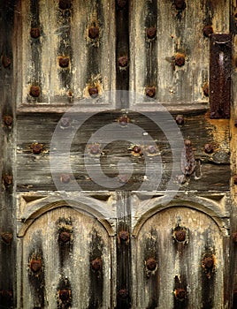 Old rusty wooden gothic door detail