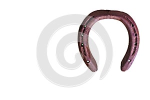 Old rusty and worn horseshoe on white background. supposedly good luck