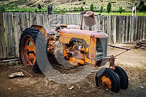 Old and rusty wreckage of a farm tractor