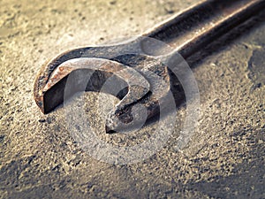 Old rusty wrench close-up in vintage style