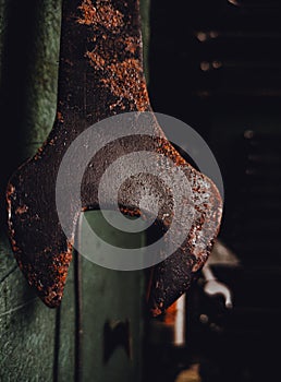 Old rusty wrench spanner tool, close up.