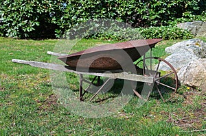 Old rusty yard wheelbarrow