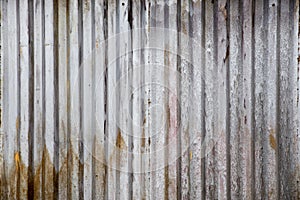 Old rusty zinc plate, vertical pattern on old metal sheet for vintage background. Grey dirty texture