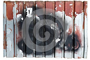 Peeling red paint. traces of black paint. dirty profiled metal sheet. on a white background. Isolated