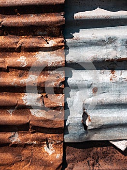 Old and rusty zinc sheet wall. Vintage style metal sheet roof texture. Pattern of old metal sheet. Rusting metal or siding.