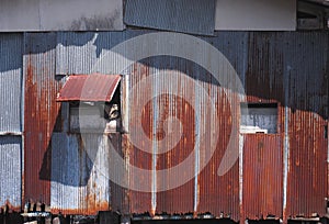 Old and rusty zinc sheet wall and windows