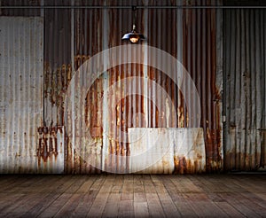 Old rusty zinc wall with Lamp lighting and wooden floor, Ideal for product display