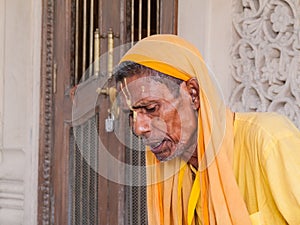 Old sadhu reading scriptures