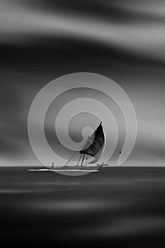 Old sailer boat with one man sailing through the strange still sea