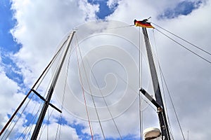 Old sailing boat mast and rope at the port of Kiel on a sunny day