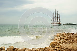 Old sailing boat at rippled sea