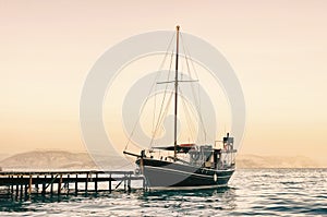 Old sailing boat at sunset