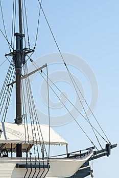 an old sailing ship on a blue sky background