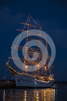 Old Sailing Ship Lit up in Midnight Blue Sky