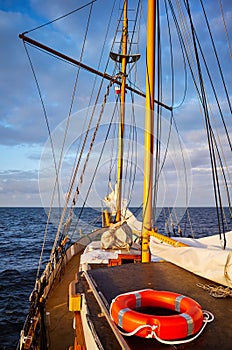 Old sailing ship at sunset.