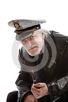 Old sailor man in hat with pipe