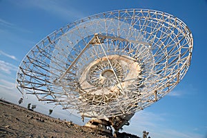 Old Satalite dish in blue sky photo