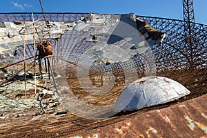 Old satellite dish antenna in dry adir land near El Medano, Tenerife, Canary Islands, Spain, telecommunication photo