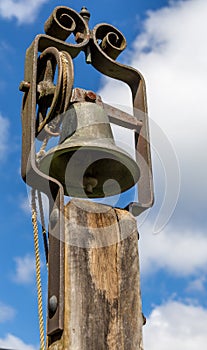 Old school bell Isolated against the sky