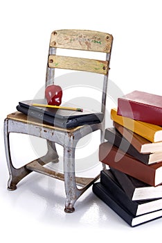 Old School Chair, Laptop and Stack of Books