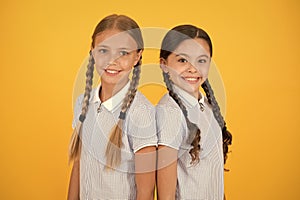 Old school fashion. back to school. happy beauty with pigtails. happy childhood. brunette and blond hair. sisterhood