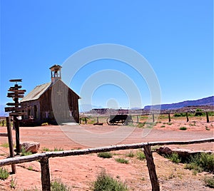 Old schoolhouse in Moab Utah with the Lasalle mountain range and red sandstone cliffs