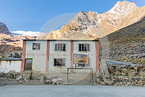 Old schoolyard building mountain town view, Bolivia.