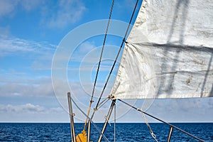 Old schooner sail with horizon over water