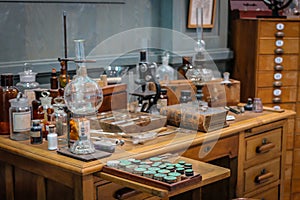 Old science lab with chemical reagents and burner