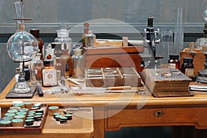 Old science lab with chemical reagents and burner