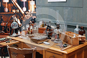 Old science lab with chemical reagents and burner