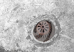 Old sewer grate drain water