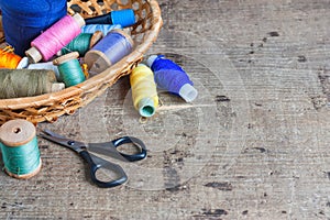 Old sewing tools on wooden background