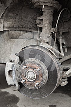 Old shabby disc brake in wheel arch